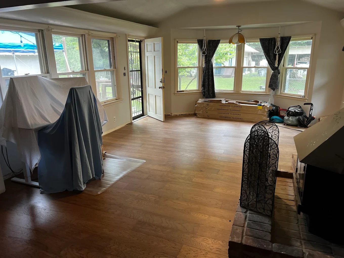 Wood flooring in a room lined with windows
